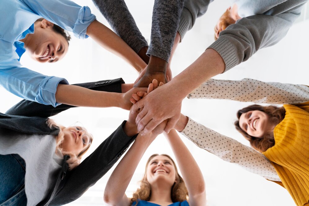 close-up-people-holding-hands_23-2149008999